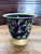 Absolutely lovely little hand painted cachepot with black background and gold trim. A beautiful mix of colors with an...