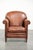 This vintage sheepskin armchair with a comfortable seat and finished with decorative studs. : This vintage sheepskin...