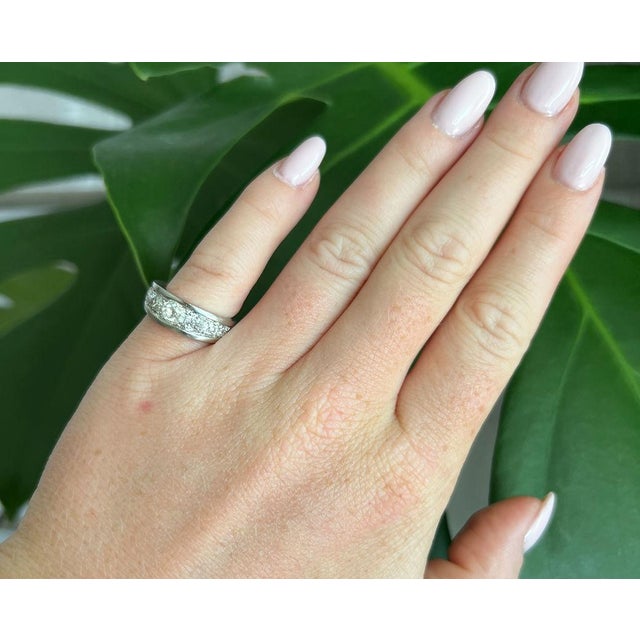 A rare and elegant Art Deco eternity band (circa 1930) crafted in platinum. The ring features a tapering design set with...