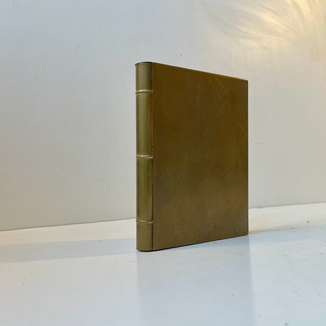 A 1920s or 30s concealed box for personal smalls or secrets. It is made in the shape of a naturally sized book (16x13x2...