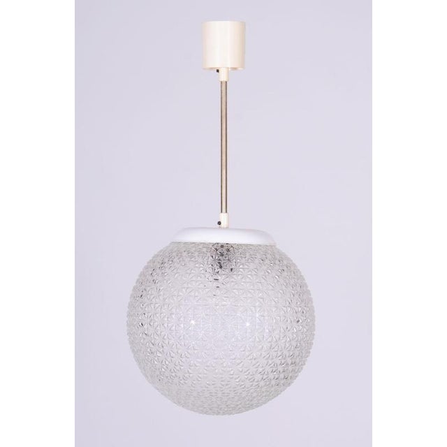 This stylish and highly elegant chandelier, originating from the 1960s from Czechoslovak production, represents an...