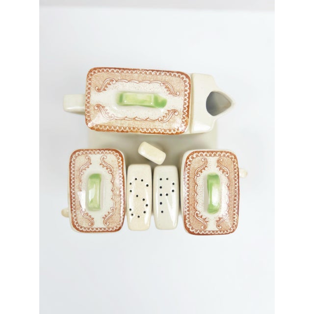 Elevate your entertaining game with this exquisite 12-piece vintage china condiment set from the 1970s. The Oriental...