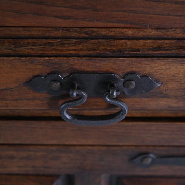 Rare Spanish oak sideboard from the 1960s. Featuring four doors, two drawers, and interior shelves, this piece is striking...