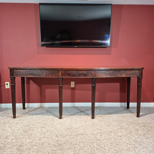 This is a really special late 18th century George III style mahogany serving table. A serving table features a large...