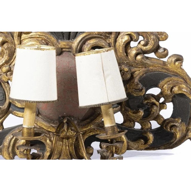 Pair of Portuguese appliques with two lights 18th century remade from painted and gilded carving decorated with plant...