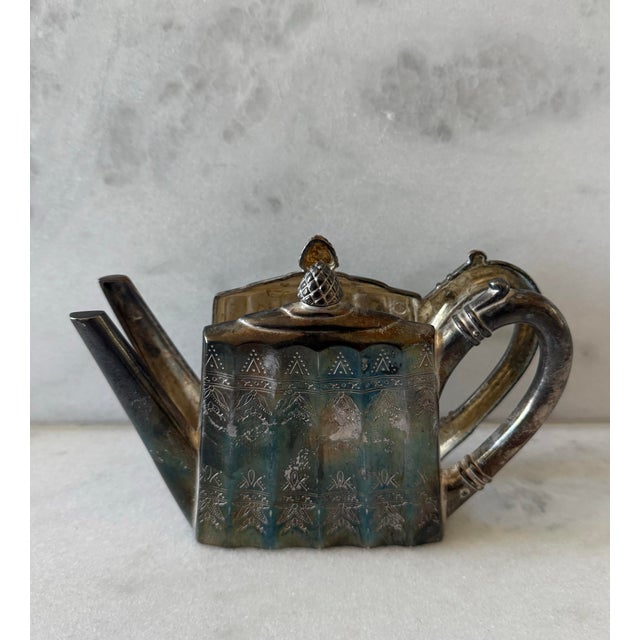 Vintage silver plate napkin holder in the shape of a teapot featuring an etched floral and geometric pattern made by...