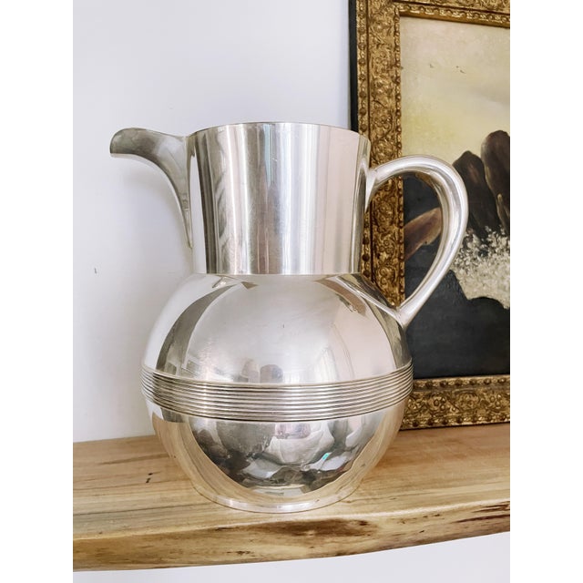 A stunning antique circa late 1800s silver plated water pitcher made by Tiffany & Co! In amazing condition for its age,...