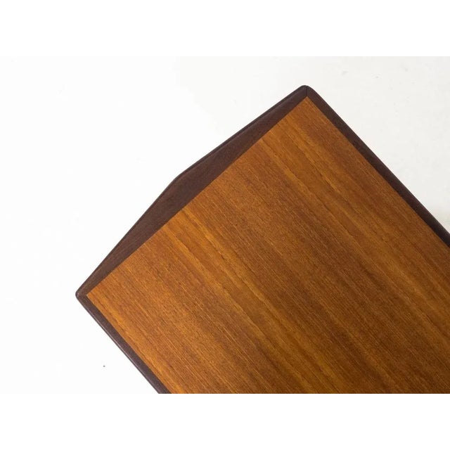 Vintage coffee table from the 1960s, most likely produced in The Netherlands. This table has a top veneered with teak, and...