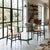 Chairs with enameled wood frames and rattan seats. There are signs of wear on the frame, and one seat has a crack. This...