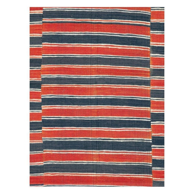 A vintage Turkish flat-weave Kilim accent rug handmade during the mid-20th century with an asymmetrical horizontally...