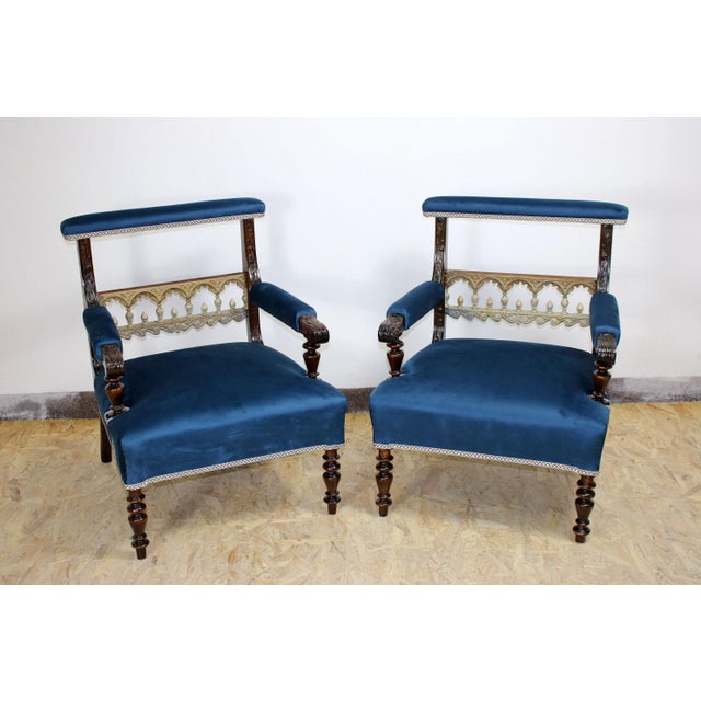 A beautiful set of two armchairs in a stunning blue. It may be of interest that this set was manufactured as a custom...