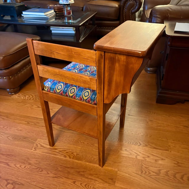 A vintage 1950’s telephone table/chair or gossip bench, with original colorful upholstered seat.