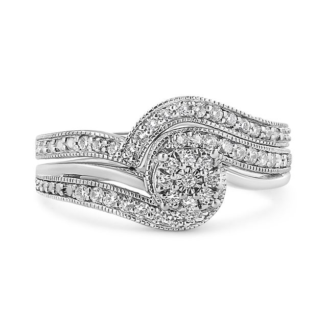 Introducing a breathtaking symbol of eternal love and timeless elegance, this .925 Sterling Silver Bridal Set Ring and...