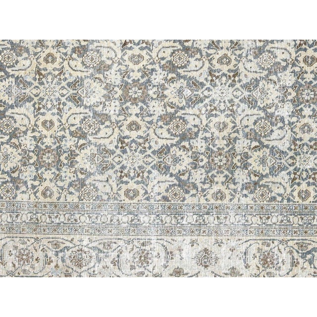 This Semi Antique Persian Tabriz Rug is handwoven in Northern Iran’s Tabriz region and has been carefully distressed and...