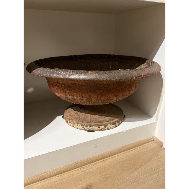 Add timeless charm and classical elegance to your outdoor or interior space with this antique cast iron garden urn....