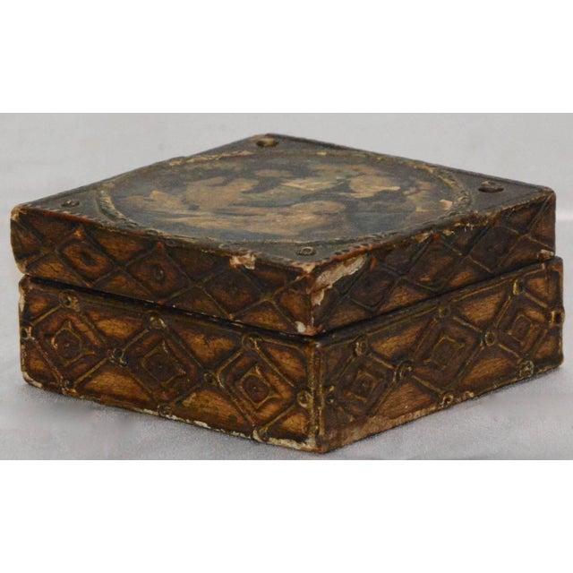 This is a fabulous wooden box is decorated with Madonna and child on the top. Adding to the elegance is the gilt finish on...