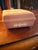This vintage Wedgwood Jasperware trinket box in pink with a white diamond shape design is a charming addition to any...
