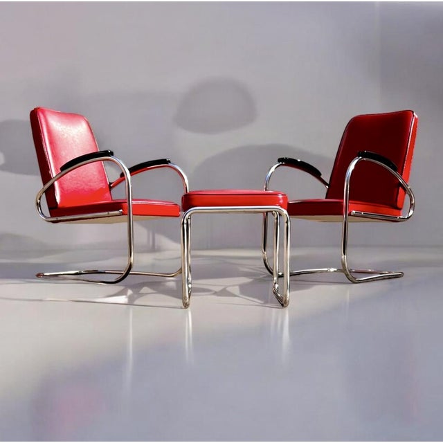 This offer includes two mauser werke mod. Rs7 tubular steel cantilever chairs and one mauser werke mod. Rh1 tubular steel...