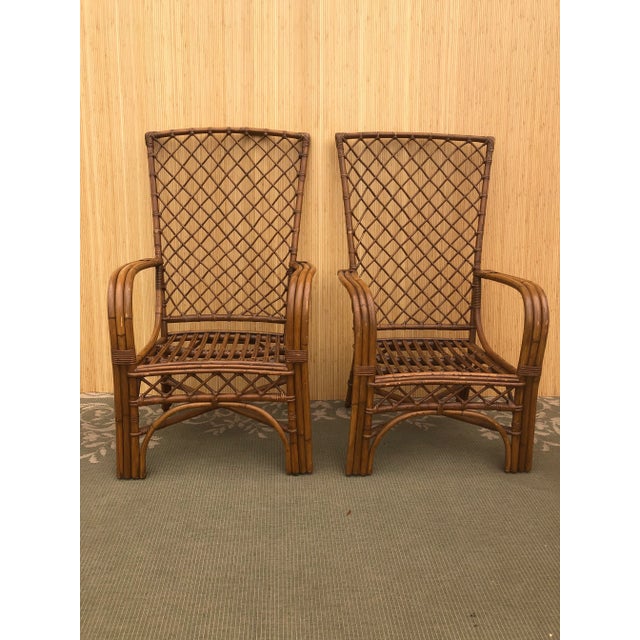 2 - Vintage Weaved Rattan High Back Lounge Chairs & one Beautiful Ottoman. 1960’s In great condition Ottoman 22” W. x 22”...