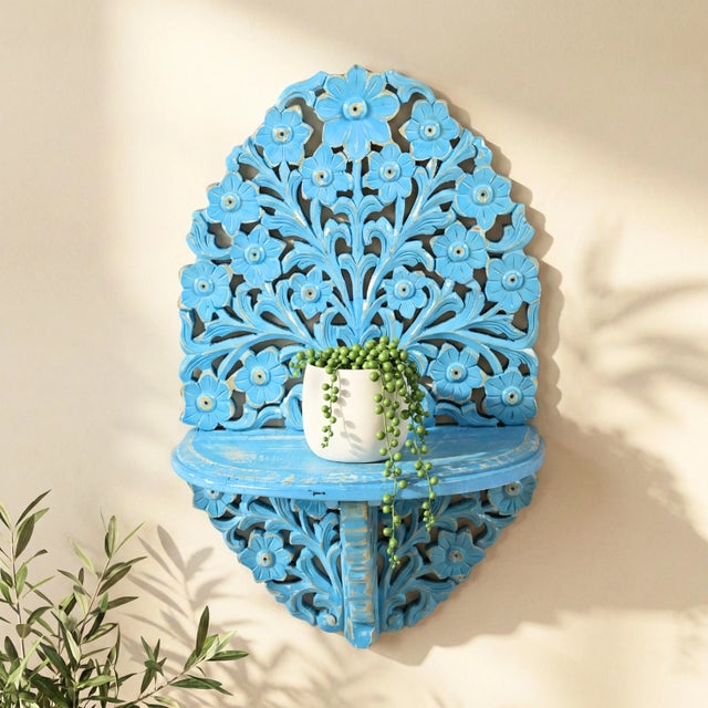 Elevate your home sanctuary with the ethereal beauty of our Hand Carved White Wood Wall Shelf. This exquisite piece is a...