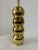 Chic Mid-Century Modern brass metal lamp with Space Age design. Comprised of four stacked brass balls or globes with...