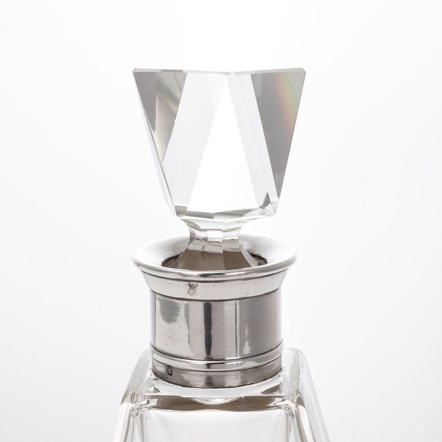Antique early-20th Century French Art Deco solid silver and glass decanter. Of mid size with straight cut crystal glass...
