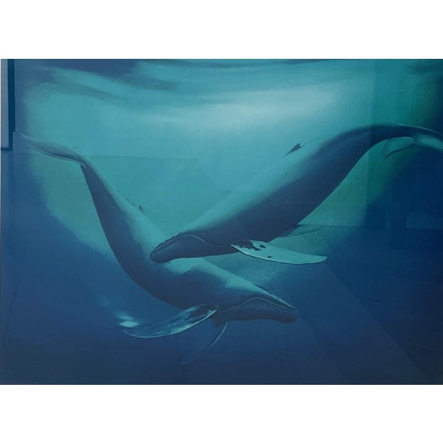 Matted, framed and numbered "Ocean Encounter" print featuring a pair of Humpback whales underwater by well established...