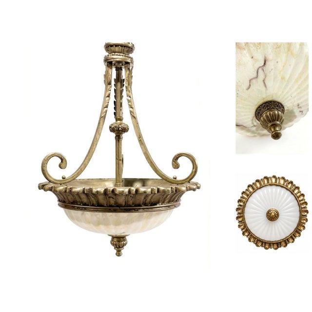 Neoclassical / Empire style Chandelier This vintage chandelier exudes classic elegance with its ornate design and rich...