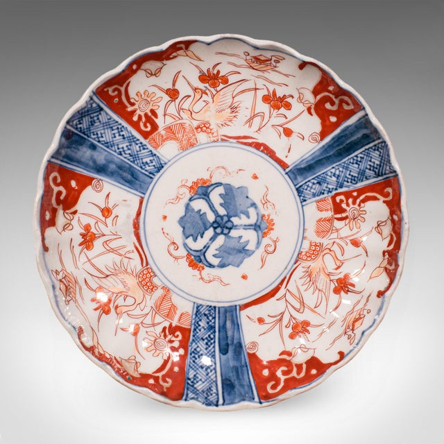 This is an antique Imari display plate. A Japanese hand-painted ceramic serving dish, dating to the late Victorian period,...