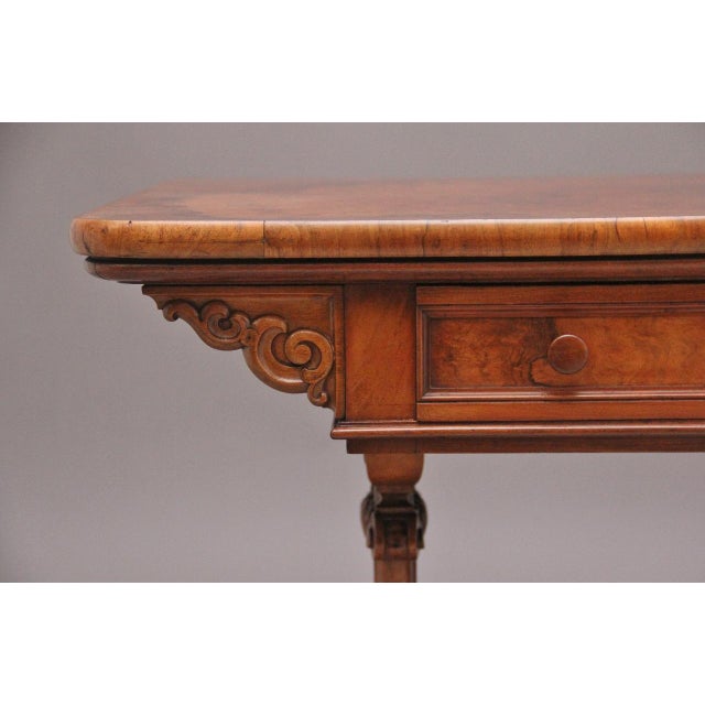 An exhibition quality mid 19th Century freestanding antique burr walnut library / sofa table, the wonderfully figured burr...