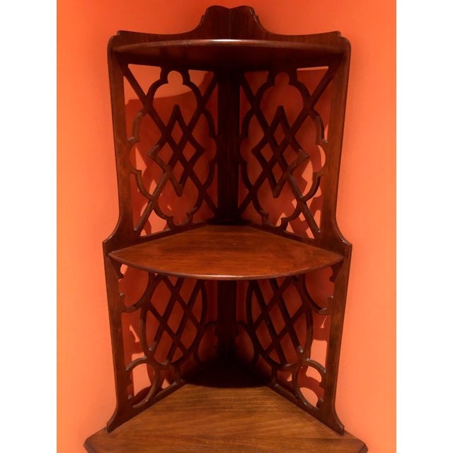 This beautiful etagere is made of mahogany, and is in excellent condition. Four shelves offers opportunities for display...