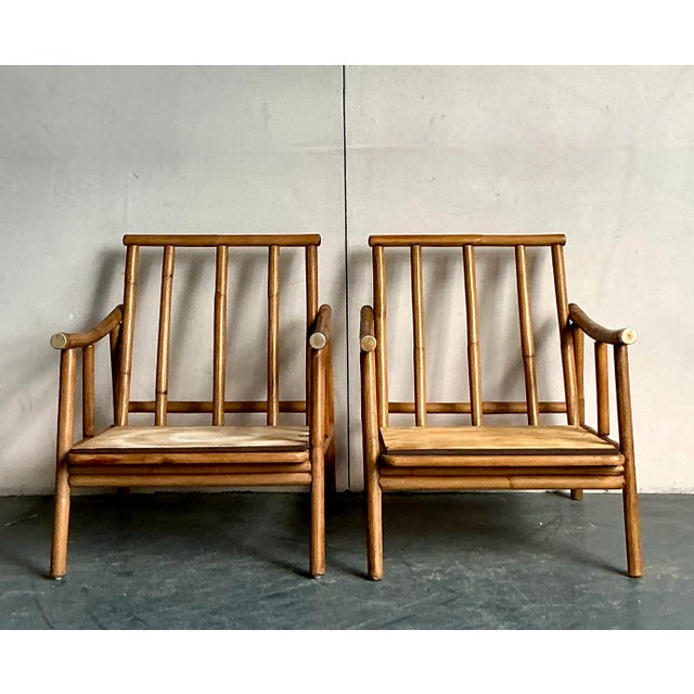 This charming pair of armchairs offers a beautiful convergence of rustic simplicity and relaxed mid-century styling,...