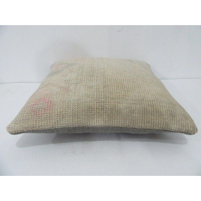 Decorative pillow cover made from a vintage Turkish handknotted rug. Backed with good quality cotton fabric. Pillow...