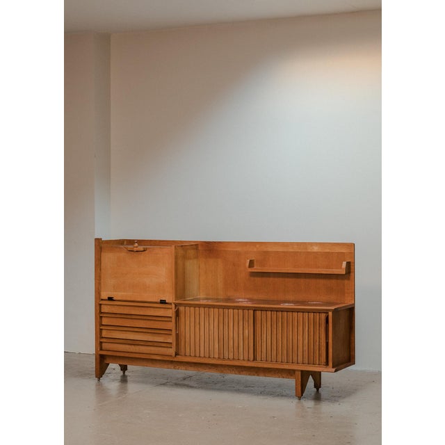 Sideboard designed by R. Guillerme and J. Chambron and produced by Votre Maison in France around 1960. This sculptural...