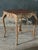 A beautifully carved center table in the French Louis XV style. 20th century reproduction featuring carvings of floral...