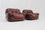 A set of 2 Italian Lounge Chairs in burgundy colour designed by Sapporo for Mobil Girgi in the 1970s. The chairs are...
