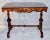 This is a quality Victorian walnut serving table with a beautifully hand carved apron and legs. The stretched base is...