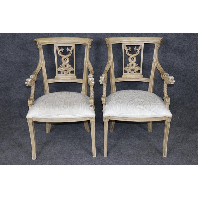 This elegant set of four Neoclassical painted side chairs is a remarkable example of refined European craftsmanship,...