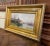 Painted in France circa 1890, this refined antique oil on canvas depicts a tranquil riverside village with a church rising...