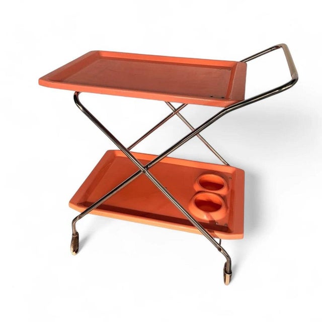 This vintage drinks trolley is a striking mid century trolley designed to elevate your serving experience while adding a...