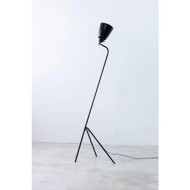 Floor lamp model 53701 produced by Uppsala Armaturfabrik. Made in Sweden during the 1950s. Black lacquered metal with...