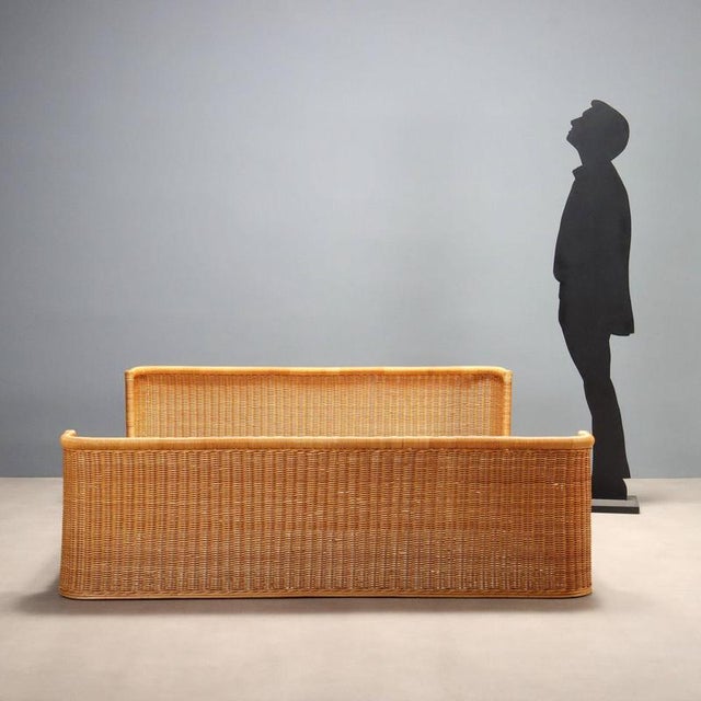 Double bed with wooden frame and woven wicker. This piece is attributed to the mentioned designer/maker. It has no...