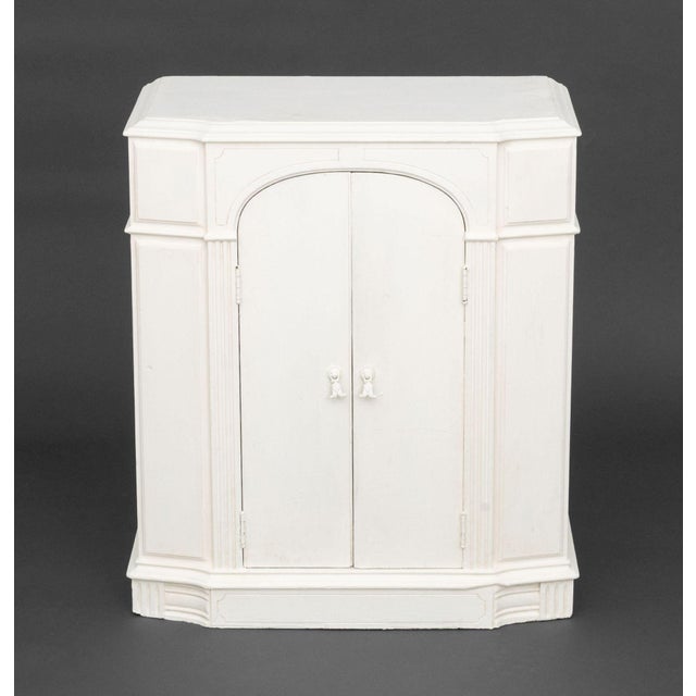 Modern White Painted Wood Cabinet, with single door opening to two shelves. 27" H x 22.75" W x 13.25" D. Provenance: From...