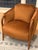 A striking pair of vintage barrel-back (tub-style) armchairs, built on solid oak frames with gracefully curved, exposed...