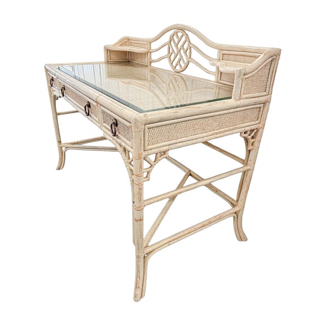 A beautifully detailed chinoiserie-style desk by Hekman Furniture featuring a softly finished cream lacquered frame with...