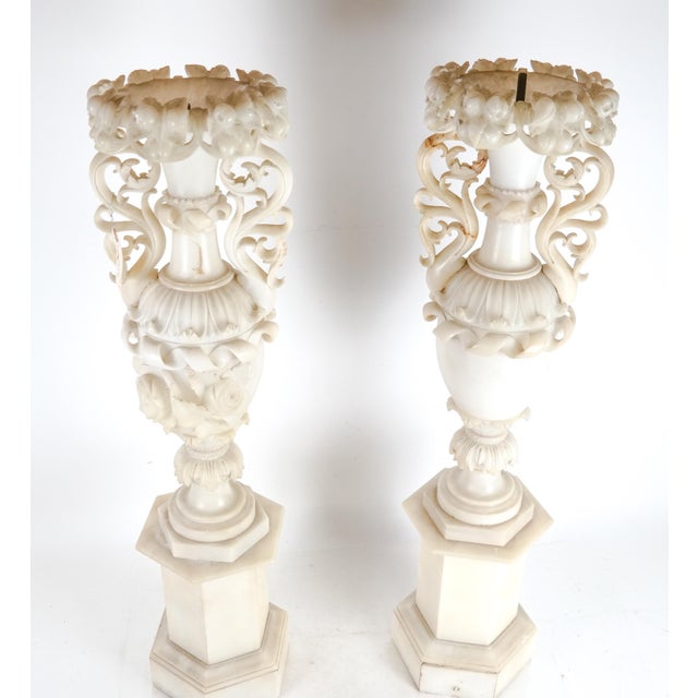 Pair of monumental Italian 19 century Alabaster vases converted to lamps with wonderful carving of flowers and fruits....