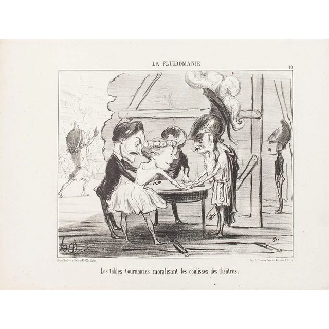 Les Tables Tournantes (…) is a original b/w lithographed plate (n. 10) from La Fluidomanie. This is a satiric series...