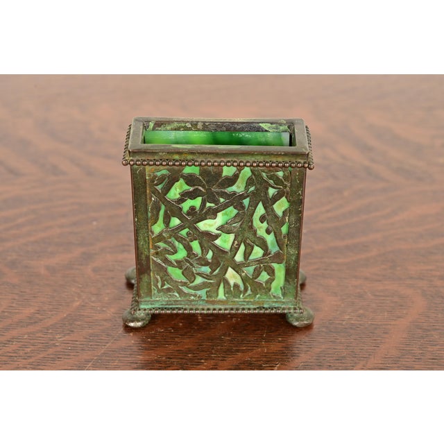 A beautiful Arts & Crafts or Art Nouveau period "Grapevine" pattern bronze and slag glass card holder with verdigris green...