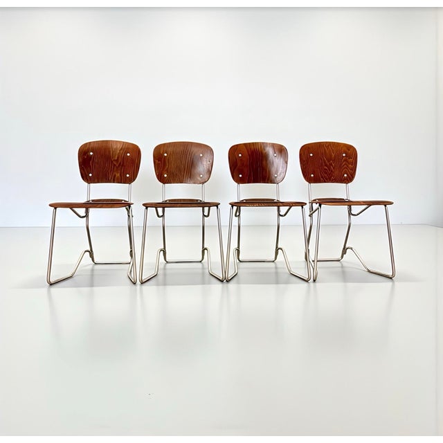 Timeless, modern, stylish, and delicate true mid-century vintage stacking/folding chairs—design classics from the early...