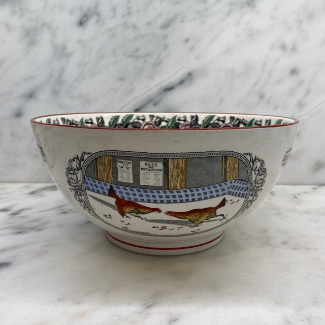 English ceramic bowl by Adams, decorated in the Old English Sport pattern with two game birds titled “Set To.” The central...